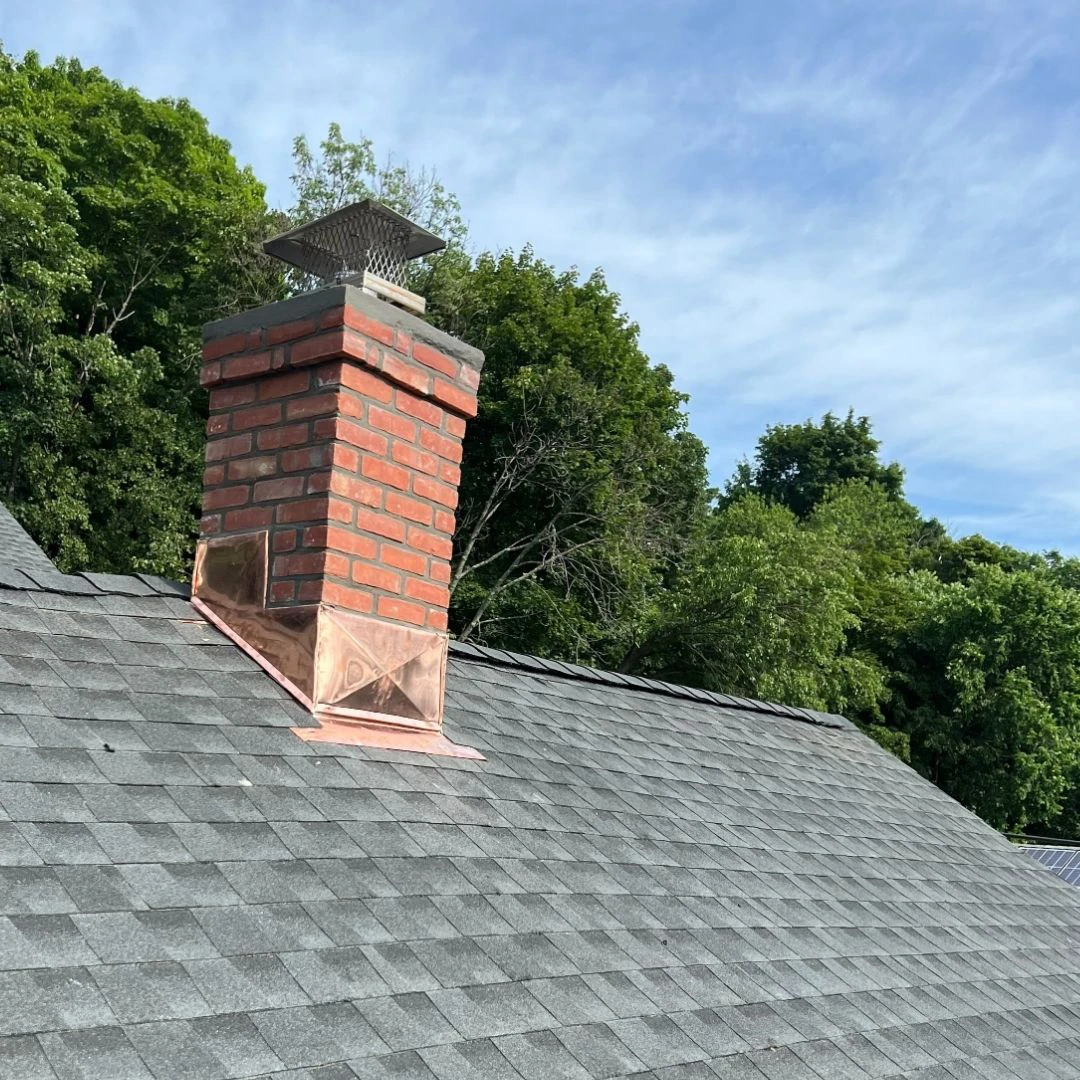 brick chimney copper flashing on shingle roof