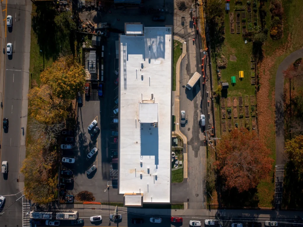 top down aerial view of a white TPO johns manville roof on residential building in new rochelle, NY