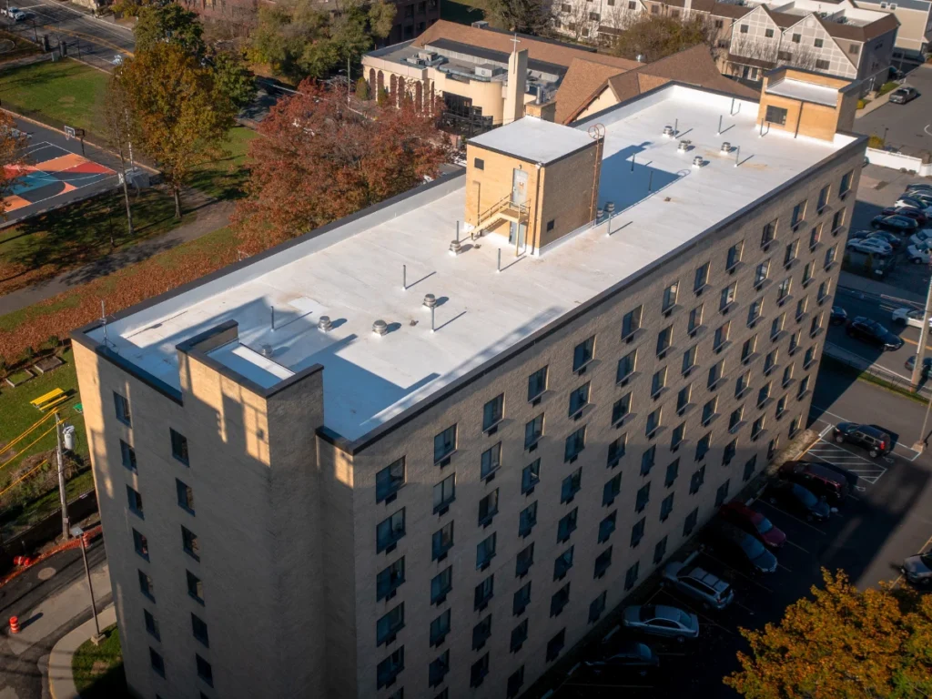 aerial view of a white TPO johns manville roof on residential building in new rochelle, NY