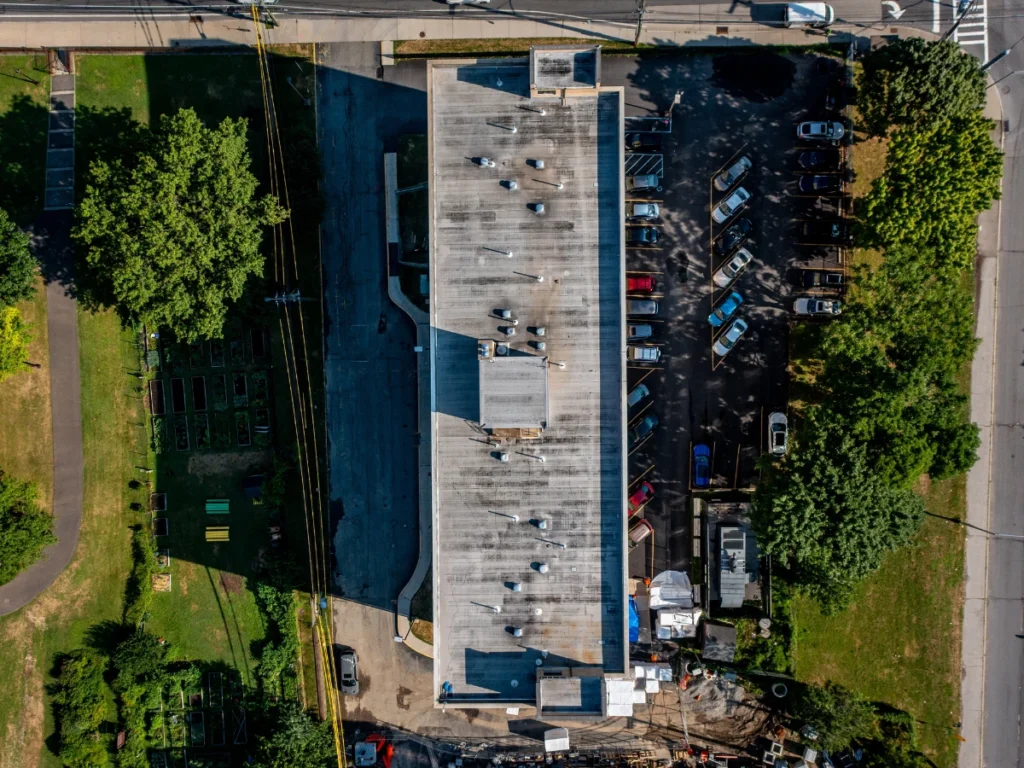 top down aerial view of a discolored flat roof on residential building in new rochelle, NY