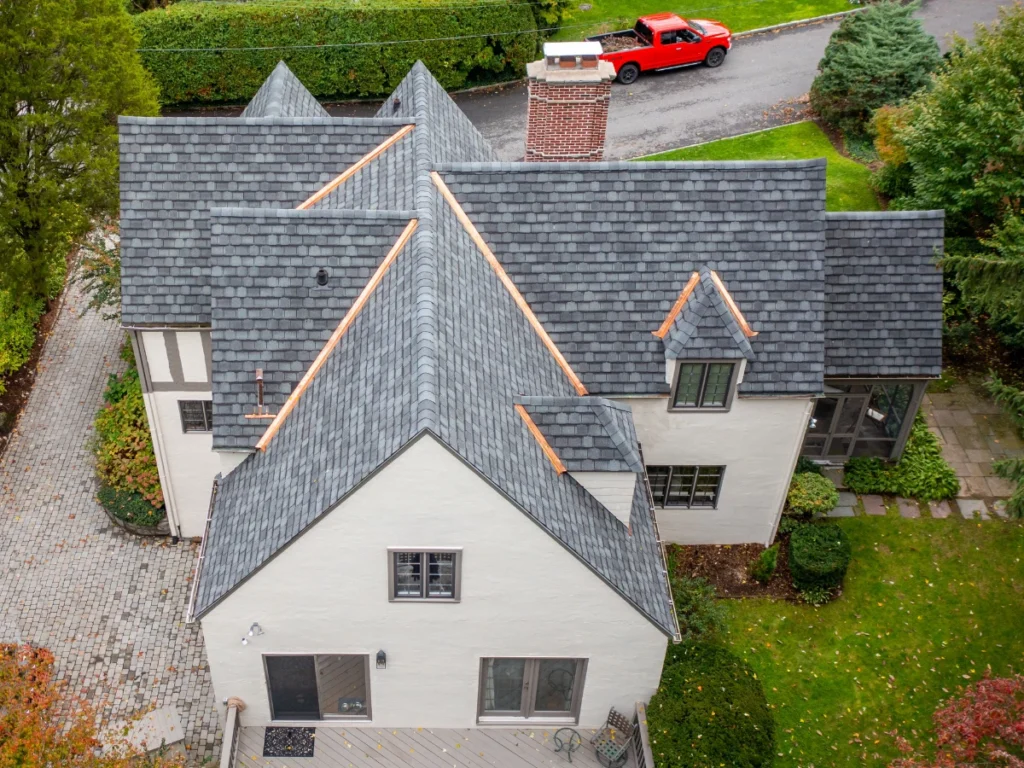 Rear view after GAF Architectural Shingle Roof Replacement Bronxville NY with copper roof valleys