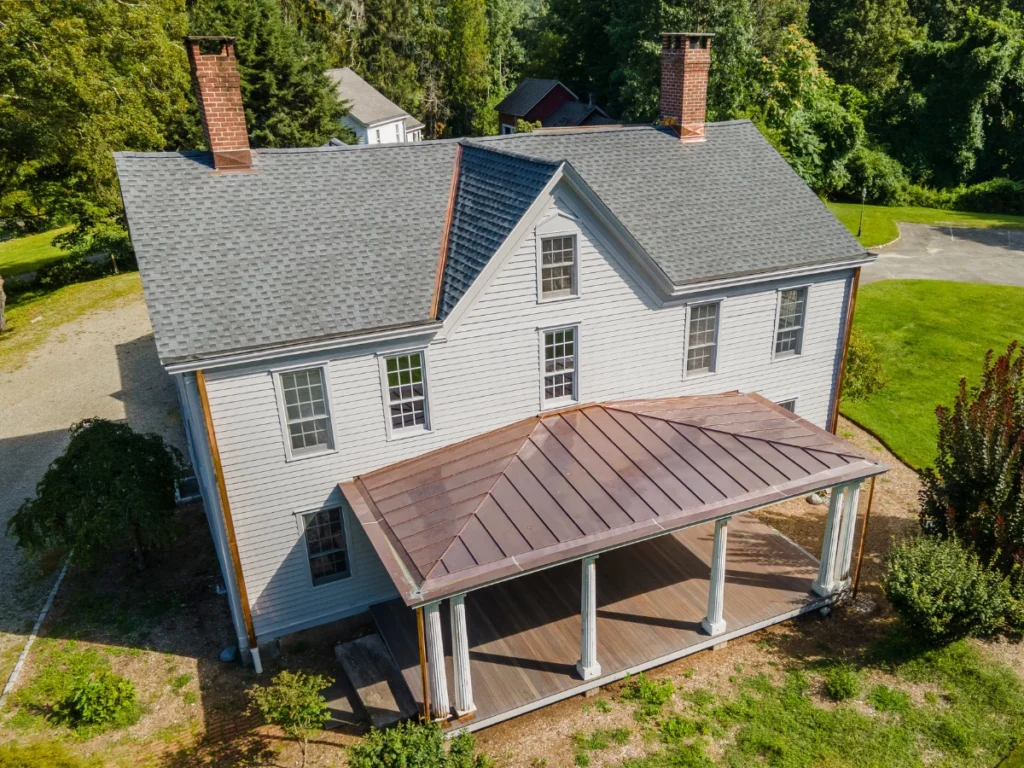 new GAF asphalt shingle roof on deans bridge rd in somers ny with a custom copper porch awning