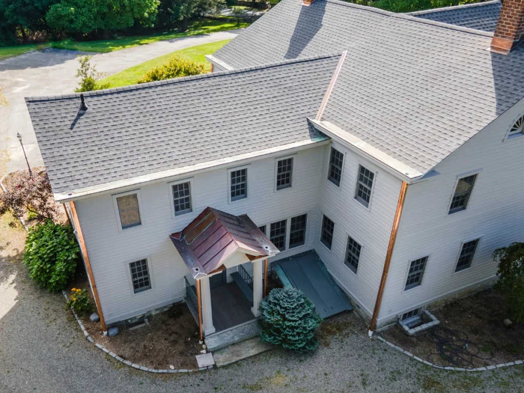 back entrance to home with custom metal roof in somers, ny