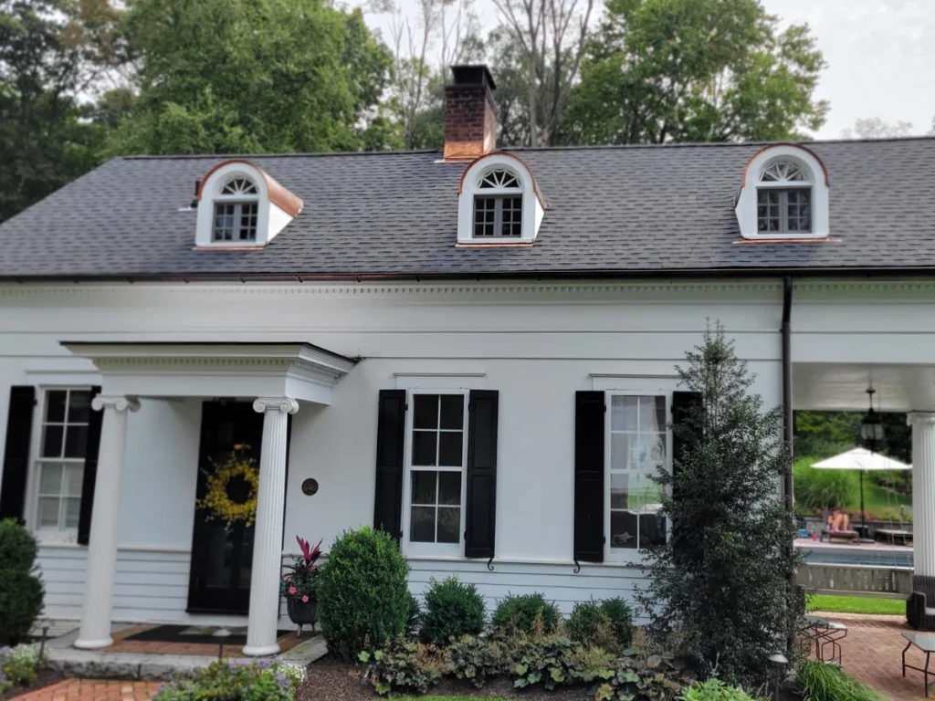 grey GAF roof shingles with copper dormers