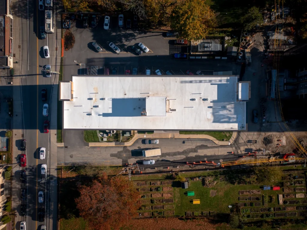 overhead drone photo o a flat white TPO roof on an apartment building near shrub oak