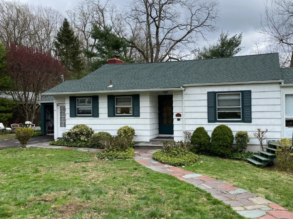 single story home with white siding and new grey asphalt roof shingles