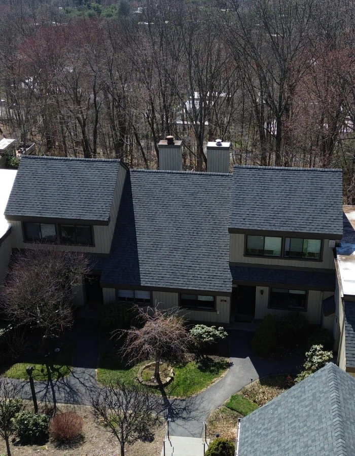 dark grey shingle roof on townhouse near ossining