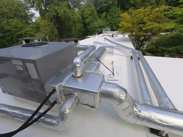 White flat commercial roof with HVAC unit near Armonk