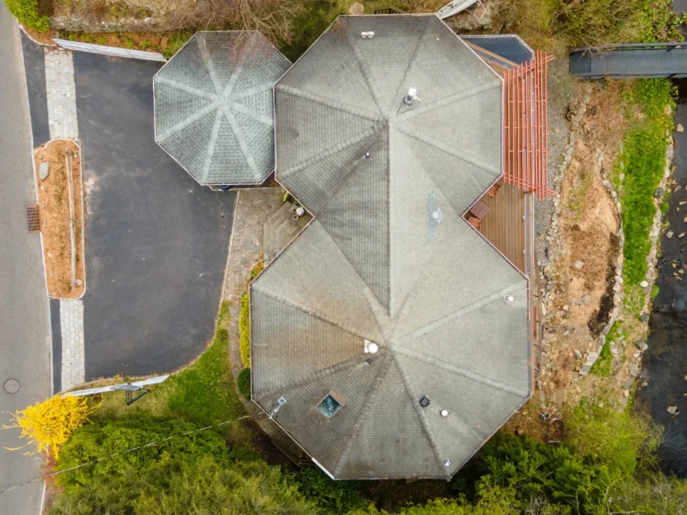 old shingles on octagon shaped roof before new metal roofing installed